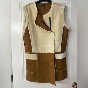 Long, sleeveless, combination suede vest.